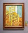 Van Gogh\\\'s Chair with Pipe. The painting shows a rustic wooden chair with a simple woven straw seat on a