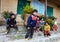 VAN, HA GIANG, VIETNAM, November 14th, 2017: Unidentified ethnic minority kids with baskets of rapeseed flower in Hagiang