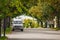 Van Lifestyle concept. Van parked in a street between trees in Autumn. Gananoque, Canada