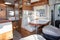 Van modern white table and seat interior in luxury camper or motorhome on rv vanlife