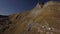 Van motorhome drive on serpentine in rocky mountains aerial Rbbro. Road trip on two recreational