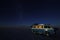 Van and starry sky on Salar de Uyuni, salt lake, Bolivia