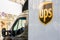 The van of UPS delivery company with a logo of the firm from left driver side