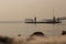 VANCOUVER, BC, CANADA - AUG 20, 2018: Children play on a dock near the ocean near a North Vancouver beach with the haze