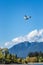 Vancouver, British Columbia, - May 5, 2019:  Fairmont Hotel commuter plane flying West over Coal Harbour.