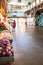 Vancouver, Canada - Apr 7, 2020: Produce shopper in empty Granville Island Market artisan space during Covid-19 pandemic