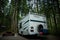 Vancouver Island, Canada, 20 august, 2019 // :Old Tioga caravan parked in a camping area in typical British Columbia camping