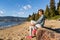 Vancouver urban lifestyle woman relaxing on Third Beach in Stanley Park, Vancouver, BC, Canada. Canadian Asian girl