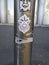 Vandalism stickers on metal pole