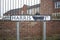 Vandalized sign painted with black spray the word `Way`  on Harris Way street in Grantham.