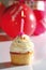 Vanilla buttercream cupcake with birthday candle