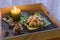 Vanilla crescents on a wooden tray by candlelight