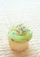 Vanilla cupcake with green lime icing