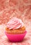 Vanilla cupcake with strawberry icing