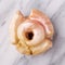 Vanilla donut closeup on marble