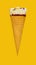 vanilla flaovr ice cream cone with a small bite on a yellow background