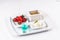 Vanilla ice cream fondue, milk chocolate, and strawberries on skewers