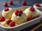 Vanilla ice cream scoops with berries