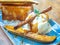 Vanilla Ice cream topping with caramel on ceramic plate. Close-up Caramelized Banana Toast homemade dessert