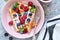 Vanilla waffles with berry in a plate for breakfast on the kitchen table. Breakfast time.