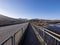 Vanishing point on bridge over Magra river in Lunigiana, near Aulla. Winter landscape. North Tuscany.