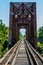 Vanishing Point View of an Old Railroad Trestle with an Old Iron Truss Bridge Over the Brazos River