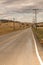 Vanishing viewpoint highway, storm clouds, wet pavement