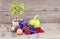 Vantage look Christmas decorations with red ball,green ball,red ribbon,bell,small tree on white pot, and artificial flower. aged a