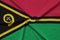 Vanuatu flag is depicted on a sports cloth fabric with many folds. Sport team banner