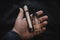 Vaping device in in the man`s hand. Electronic cigarette, vape