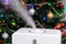 Vapor from humidifier on Christmas background