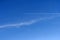 Vapor trails on the blue sky