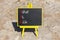 VAR Value at risk symbol. Concept words VAR Value at risk on beautiful black chalk blackboard. Beautiful stone beach background.