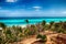 Varadero beach with tyrquis sea and ocean. There is a lot of green palms. Blue sky is in the background. It is beautiful natural