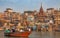 Varanasi ancient city architecture with view of tourist boat on river Ganges