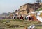 Varanasi ghats people washing clothes on the street on the banks of the river Ganges