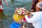 Varanasi, India, 27 Mar 2019 - Indian man selling pooja flowers items for the offering