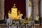 Varanasi, India: Golden statue of sitting Buddha in meditation at the Buddhist temple Mulagandhakuti vihara,