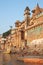 Varanasi, India â€“ October 11, 2010: People bathing in the Ganges from the ghats and among the beautiful buildings of Varanasi