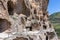 Vardzia cave monastery complex in Georgia, mountain slope with caves, tunnels and dwellings carved in the rock