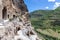 Vardzia cave monastery complex in Georgia, mountain slope with caves, tunnels and dwellings carved in the rock