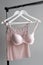 Vareity of pink bra hanging on a hanger. Textile, Underwear. Female bra in lingerie underwear store. Advertise, sale