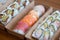 Variable Japanese sushi in brown paper to go boxes