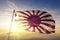 Variant of Flag Of Japan with sixteen rays on the central sun flag textile cloth fabric waving on the top sunrise mist fog