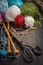 Variation of wool balls for knitting with old scissors in vintage style