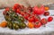 Varicolored cherry tomatoes, single ordinary tomato on old wooden surface