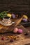 Varicolored tasty macaroon cookies lie on a wooden background with a cup of coffee. Continental breakfast
