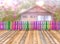 Varicolored wooden fence and floor wood with blurry house in th
