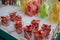 Varieties of cut fresh fruit, ready to eat, street retail stall strawberry, pineapple, watermelon, mango