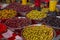 Varieties of green and purple olives at a market